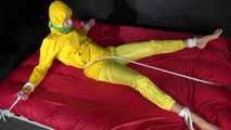 Watching sexy Pia being tied and gagged with ropes on a bed and a clothgag wearing sexy yellow shiny nylon rainwear (Video)