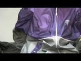 Pia bound and gagged on bed in a shiny purple/silver PVC sauna suit (Video)