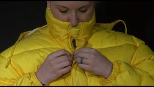 Watching Mara putting on a down jacket, rubber boots and a lifevest (Video)