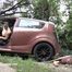 Mistress Jenna stands on the slave with a car while smoking in the slave's mouth A