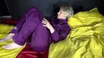 Watching sexy Sonja weraing a sexy down skirt and a down jacket putting on a sexy purple rainsuit (Video)