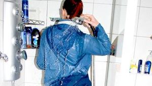 Watching Jill during taking a shower in an oldschool lightblue shiny nylon shorts and a blue rainjacket (Pics)