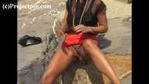 016169 Eve Takes A Discrete Pee On The Rocks