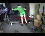 Lucy wearing a green shiny nylon shorts and a green rain jacket lolling on bed (Video)