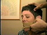 47 Yr OLD UNCOOPERATIVE LATINA HAIR DRESSER IS WRAP TAPE GAGGED & BALL-TIED ON THE BED (D47-11)
