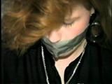 DOLL FACE APRIL TAPES UPS, GAGS & HANDCUFFS HERSELF (D20-11)