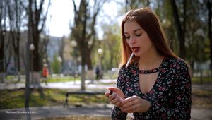 Talking to Christine while she is smoking 120mm Saratoga sitting on the bench in the park