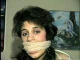 19 Yr OLD LATINA HOUSEWIFE WASHCLOTH MOUTH STUFFED, ACE BANDAGE WRAP GAGGED, BALL-GAGGED & HOG-TIED ON BED (D43-8)
