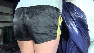 Watching Pia wearing a sexy black/yellow shiny nylon shorts and a grey tshirt while preparing the bed (Video)