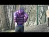 Alina wearing a jeans over a sexy shiny nylon shorts and a purple down jacket strolling on a lake (Video)