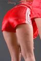 Blonde archive girl posing infront of a mirror wearing sexy red shiny nylon shorts and a red rain jacket (Pics)