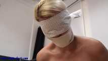 Tied up to the chair with nipple clamps