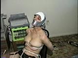 26 Yr OLD K-MART CLERK WRAP TAPE GAGGED WEARING BATHING CAP, MOUTH STUFFED. TIT TIED, CROTCH ROPED, NUDE, GARTER BELT & NYLON STOCKINGS TIGHTLY TIED TO A CHAIR (D63-13)