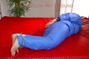Jill ties, gagges and hoodes herself on bed wearing a supersexy lightblue downwear comnbination (Pics)