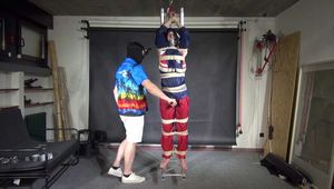 Myxxxy bound, gagged and suspended in shiny nylon Rainwear