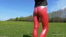 Red leggings on a green meadow