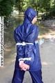 Stella bound outdoor in a blue rainsuit