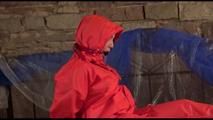 Jill tied, gagged and hooded on a princess bed wearing shiny orange rainwear (Video)