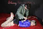 Watching sexy Sonja wearing a sexy shiny nylon shorts and a rain jacket being tied from Miss D with ropes (Pics)