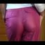 Lulu wearing a supersexy pink rain pants and a white/pink/purple rain jacket while posing in front of the mirror (Video)