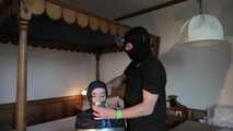 Rachel Adams bound, pantygagged and pantyhooded in shiny nylon Rainwear