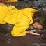 Stella lolling on bed wearing sexy shiny nylon rainwear (Pics)