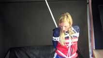 SANDRA being tied and gagged overhead with ropes and a clothgag wearing a sexy oldschool shiny nylon shorts and a rainjacket (Video)
