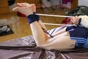 Mara tied and gagged on bed with ropes and a cloth wearing hot shiny nylon shorts and rain jacket (Pics)