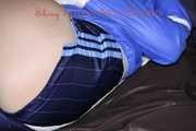 Sexy Sonja being tied and gagged on a sofa with ropes and a clothgag wearing a sexy oldschool blue shiny nylon shorts and a blue rain jacket (Pics)