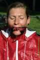 Watch Sandra enjoying beeing bound and gagged in her shiny nylon Rainsuit with a special nylon Hood 