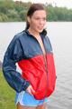 Sexy archive girl walking on a lake wearing a sexy shiny nylon shorts and an oldschool rain jacket (Pics)
