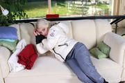 Nina bound in white downjacket and rainpants