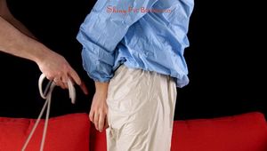 Julia tied and gagged in a shiny PVC suit