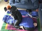 02:45 Min. video with a girl tied and gagged in a skisuit and a big shiny nylon bag to lie in from our archive