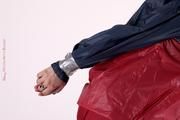 Shelly bound and gagged in shiny nylon rainwear