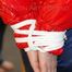 Mara tied and gagged on bed wearing a sexy shiny red down jacket and a blue rain pants (Pics)