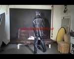 Watching Mara wearing sexy black rainwear during sorting her ropes for the next bondage session (Video)