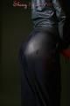Alina posing in a studio wearing a supersexy darkblue rainwear combination (Pics)