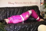 Mara tied and gagged ob a black sofa wearing a supersexy pink downwear (Pics)