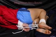 Samantha tied and gagged in a shiny light blue nylon shorts and a red shiny rainjacket (Pics) 