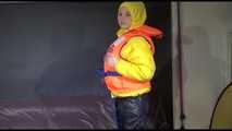 Watching Mara putting on a down jacket, rubber boots and a lifevest (Video)