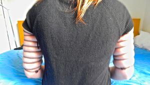 Leas upper arms are tightly laced