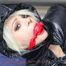 Nina tied and gagged in a shiny downjacket and rainpants