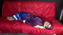 SANDRA being tied and gagged on a sofa with ropes and a clothgag wearing a sexy blue shiny nylon rain pants and a purple rain jacket  (Video)