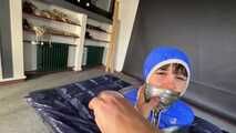 Lana tied and gagged in shiny nylon Rainwear desperately trying to free herself