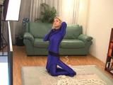 Gina in blue Lycra catsuit