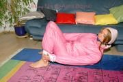 Katharina tied and gagged in shiny nylon ski suit