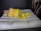 Watch Pia enjoying Bondage in her shiny nylon yellow Rainwear