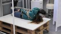 Poor Rey got catched by a mean couple which heavily tied and gagged her in her new shiny Down jacket. They stored her on a rolling table and gave her some bad news before Rey got tickeled, laughing in her pantygag.