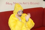 Jill ties, gagges and hoodes herself wearing a shiny yellow down jacket and a yellow rain pants(Pics)